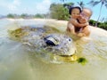 Family snorkeling with turtle