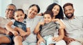 Family on sofa smile with parents, children and their grandparents in home living room. Group of people with kids, mom Royalty Free Stock Photo