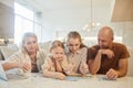 Family Solving Jigsaw Puzzle Royalty Free Stock Photo