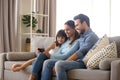 Family spend free time watching cartoons on mobile phone