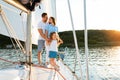 Family Spending Summer Sailing On Yacht, Posing Standing On Deck