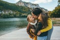 Family spending time together by the lake