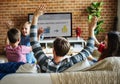 Family spending time together watching TV