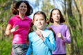 Family sport, happy active mother and kids jogging outdoors Royalty Free Stock Photo