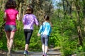 Family sport, happy active mother and kids jogging outdoors