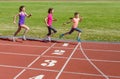 Family sport, mother and kids running on stadium track, training and children fitness Royalty Free Stock Photo