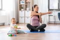 Happy mother with little baby exercising at home Royalty Free Stock Photo