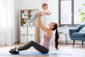 Happy mother with little baby exercising at home Royalty Free Stock Photo