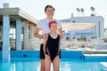 Family, sport, swimming, health, lifestyle concept. Portrait of mom and kid daughter