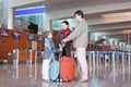 Family standing in airport hall with suitcases Royalty Free Stock Photo