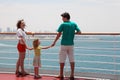 Family standing on cruise liner deck Royalty Free Stock Photo