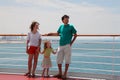 Family standing on cruise liner deck Royalty Free Stock Photo