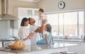 Moments before a family adventure. a family standing in the kitchen together at home.