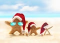 Family of starfish on summer beach and Santa hat. Merry Christmas Royalty Free Stock Photo