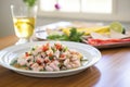 family-style serving of ceviche on a platter with tortilla chips