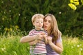 Family summer - blowing dandelion seeds Royalty Free Stock Photo