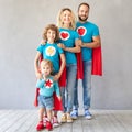 Family of superheroes playing at home Royalty Free Stock Photo