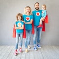Family of superheroes playing at home Royalty Free Stock Photo