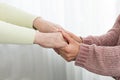 Family support. Senior woman and daughter holding hands Royalty Free Stock Photo