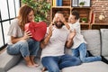 Family surprise father with heart box gift at home