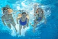 Family swim in pool or sea underwater, mother and children have fun in water Royalty Free Stock Photo