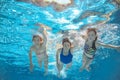 Family swim in pool or sea underwater, mother and children have fun in water Royalty Free Stock Photo