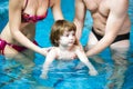 Family swimming in the pool. Happy family spends time and relax in the swimming pool Royalty Free Stock Photo