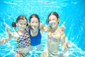 Family swims in pool under water, happy active mother and children have fun, fitness and sport Royalty Free Stock Photo