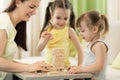 Family at the table playing board game Royalty Free Stock Photo