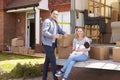 Family On Tail Lift Of Removal Truck Moving Home Royalty Free Stock Photo