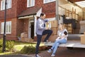 Family On Tail Lift Of Removal Truck Moving Home Royalty Free Stock Photo