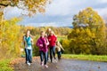 Family take a walk in autumn forest Royalty Free Stock Photo