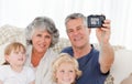 Family taking a photo of themselves Royalty Free Stock Photo