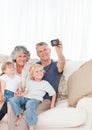 Family taking a photo of themselves Royalty Free Stock Photo