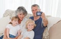 Family taking a photo of themselves Royalty Free Stock Photo