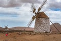 Family taking a photo at the Windmills in La Oliva on the island of Fuerteventura in Spain in 2020