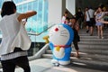 Family Taking Photos with Doraemon Figure Royalty Free Stock Photo