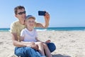 Family taking selfie at the beach Royalty Free Stock Photo