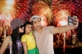 Family taking selfie photo in the fireworks festival