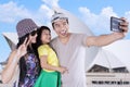 Family taking selfie photo at Opera House