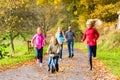 Family taking walk in autumn fall forest Royalty Free Stock Photo