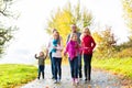 Family taking walk in autumn forest Royalty Free Stock Photo