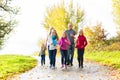 Family taking walk in autumn forest Royalty Free Stock Photo