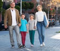 Family taking a walk in town Royalty Free Stock Photo