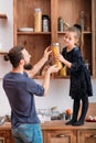 Family teamwork father kitchen little assistant Royalty Free Stock Photo