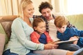 Family, tech and together on couch for streaming with happiness, internet connection and rapport. Parents, young