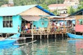 Family on terrace in fishermen village in Manokwari