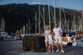 Family with their daughter on a jetty at the lake in the summer on the way to fishing Royalty Free Stock Photo