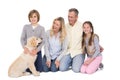 Family with their dog posing and smiling at camera together Royalty Free Stock Photo