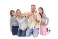 Family with their dog posing and smiling at camera together Royalty Free Stock Photo